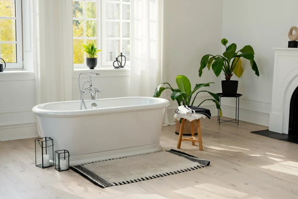 Stylish modern bathroom interior. Horizontal view of an empty free-standing bathtub